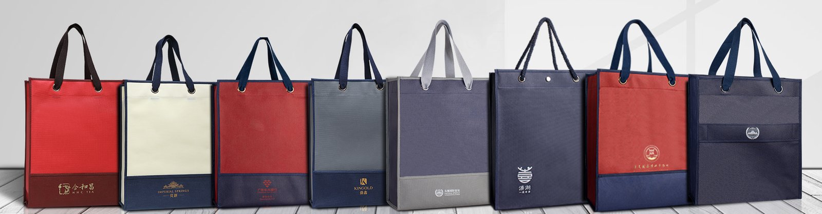 Custom non-woven tote bags in various colors with logo printing