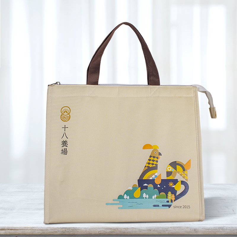 Lifestyle front view of custom beige insulated cooler bag on a table