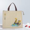 Custom beige cooler bag front view Front view of custom beige insulated cooler bag with brown handles, zipper, and cartoon illustration