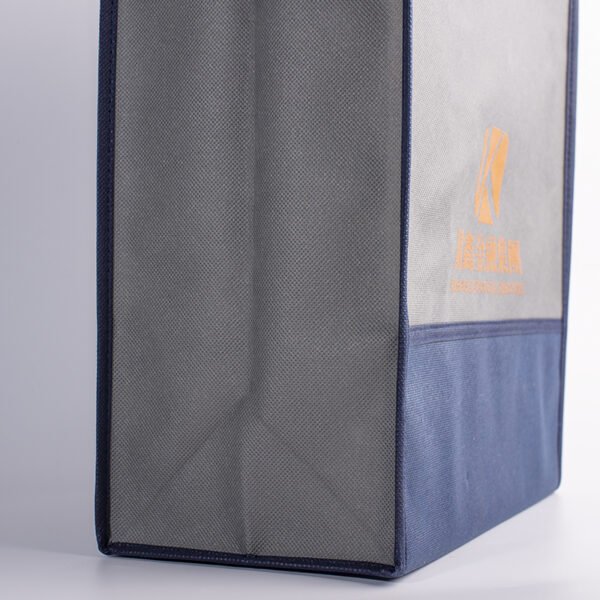 Custom non-woven tote bag side view Side view of custom non-woven tote bag showing structured shape