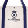 Close-up of premium embroidered hotel logo and snap button closure on canvas tote bag