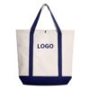 Custom two-tone canvas tote bag with navy blue handles and bottom, featuring a metal snap button and logo placement area. Studio shot on white background.