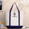 Lifestyle shot of two-tone canvas tote bag placed on a table in a cozy environment