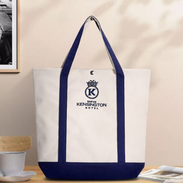 Lifestyle shot of two-tone canvas tote bag placed on a table in a cozy environment
