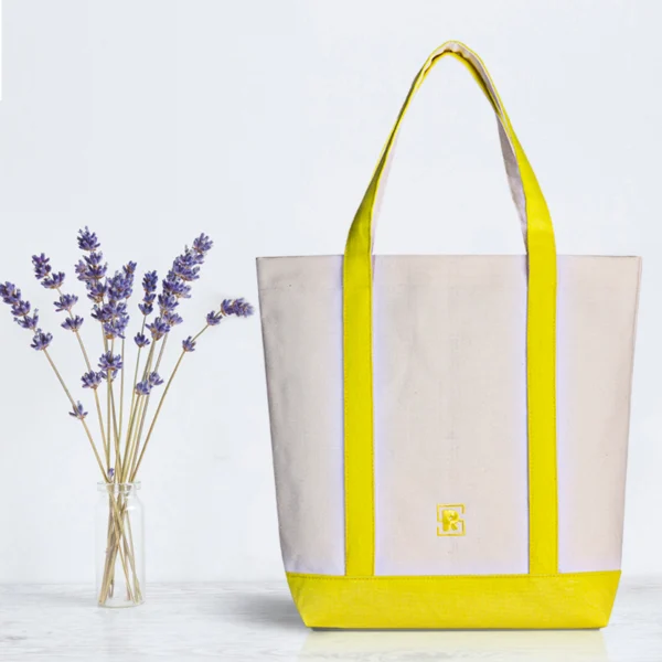 Canvas tote bag lifestyle scene Lifestyle shot of a custom two-tone canvas tote bag with extended handles, perfect for daily shopping and corporate gifts